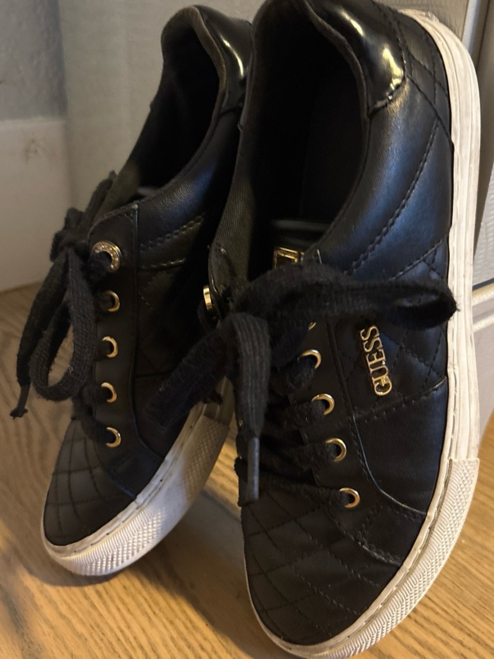 GUESS Black Quilted Sneakers with Gold Hardware